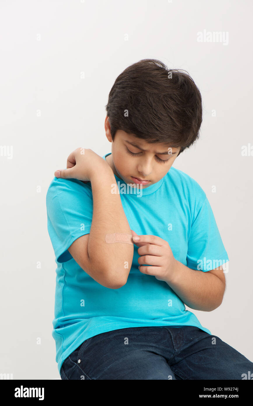 Boy with bandage on his hand Stock Photo Alamy