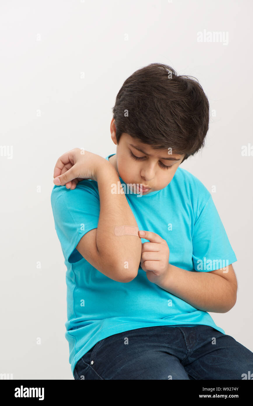 Boy with bandage on his hand Stock Photo Alamy