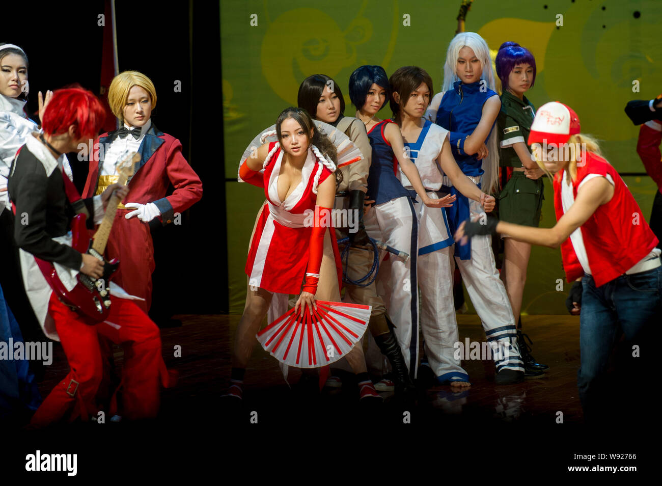 Chinese contestants dressed in the costumes of the figures in the electronic video game KOF (The King Of Fighters) perform in the final of the 10th Su Stock Photo