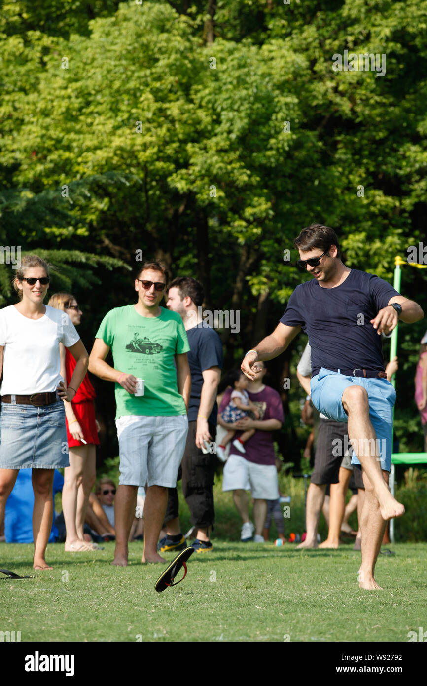 A foreign entrant, right, kicks a flip-flop during the 4th Throw Tatane ...