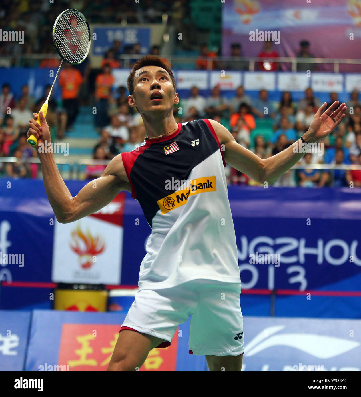 Malaysian badminton player Lee Chong Wei hits back during the Mens Singles finals of the 2013 BWF World Championships in Guangzhou, south Chinas Guang Stock Photo
