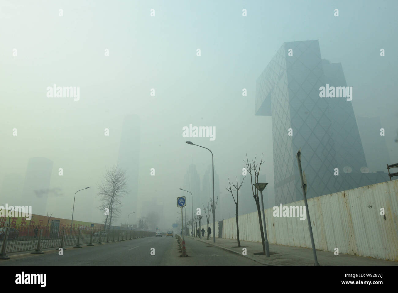 The CCTV Tower is seen in heavy smog in Beijing, China, 28 January 2013.   Air pollution went from bad to worse in Beijing yesterday, a day after resi Stock Photo