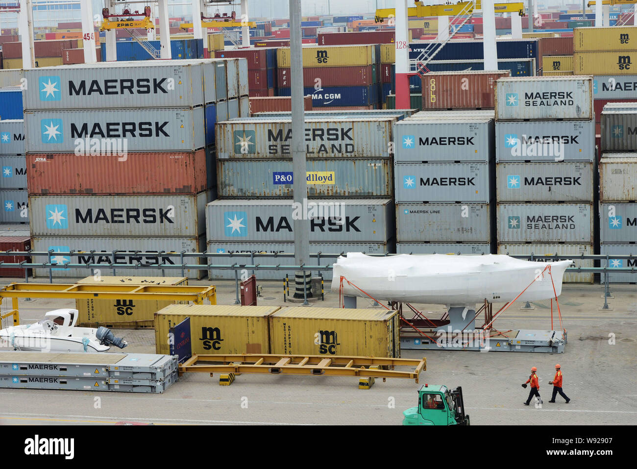 View of containers uploaded onto a container carrier at the Qingdao port in Qingdao, east Chinas Shandong province, 8 May 2013.   Chinas exports and i Stock Photo