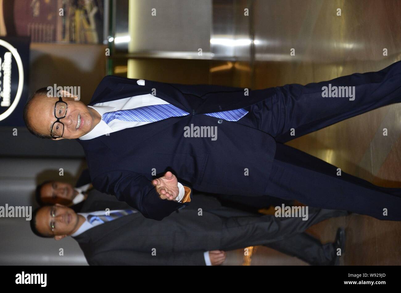 --FILE--Li Ka-shing, front, Chairman of Cheung Kong (Holdings) Limited and Chairman of Hutchison Whampoa Limited, arrives for the wedding ceremony of Stock Photo