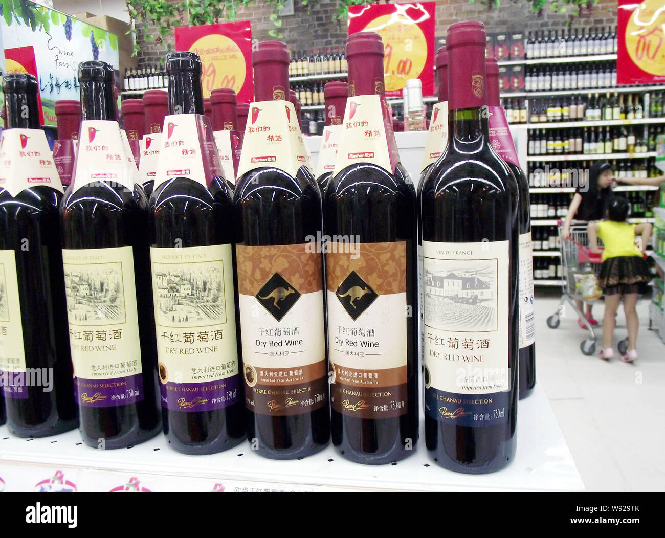 --FILE--Bottles of wine imported from France, Australia and Italy are displayed for sale at a supermarket in Nanjing, east Chinas Jiangsu province, 23 Stock Photo