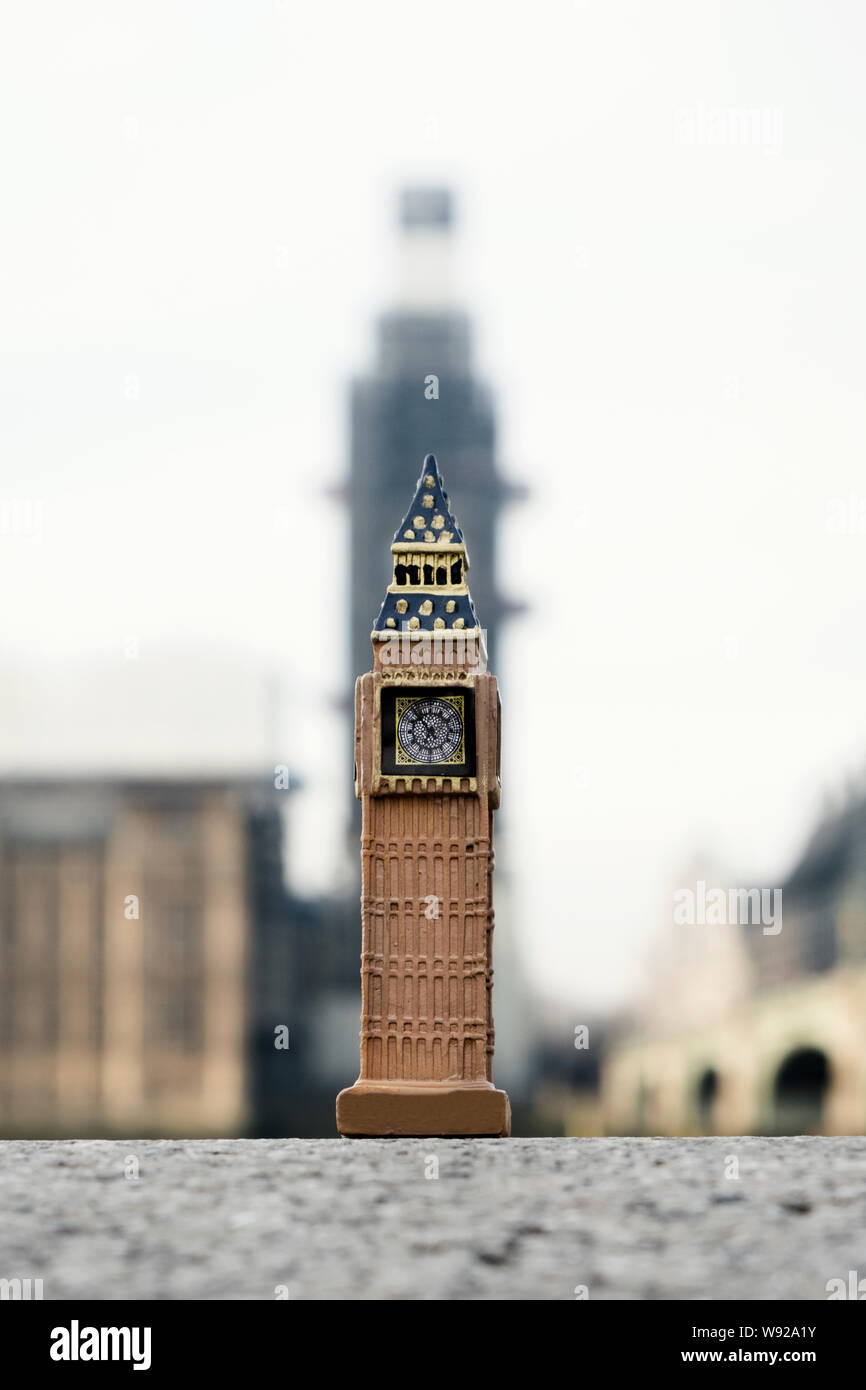 a miniature of the Clock Tower in front of the original tower of the Palace of Westminster in London, United Kingdom Stock Photo