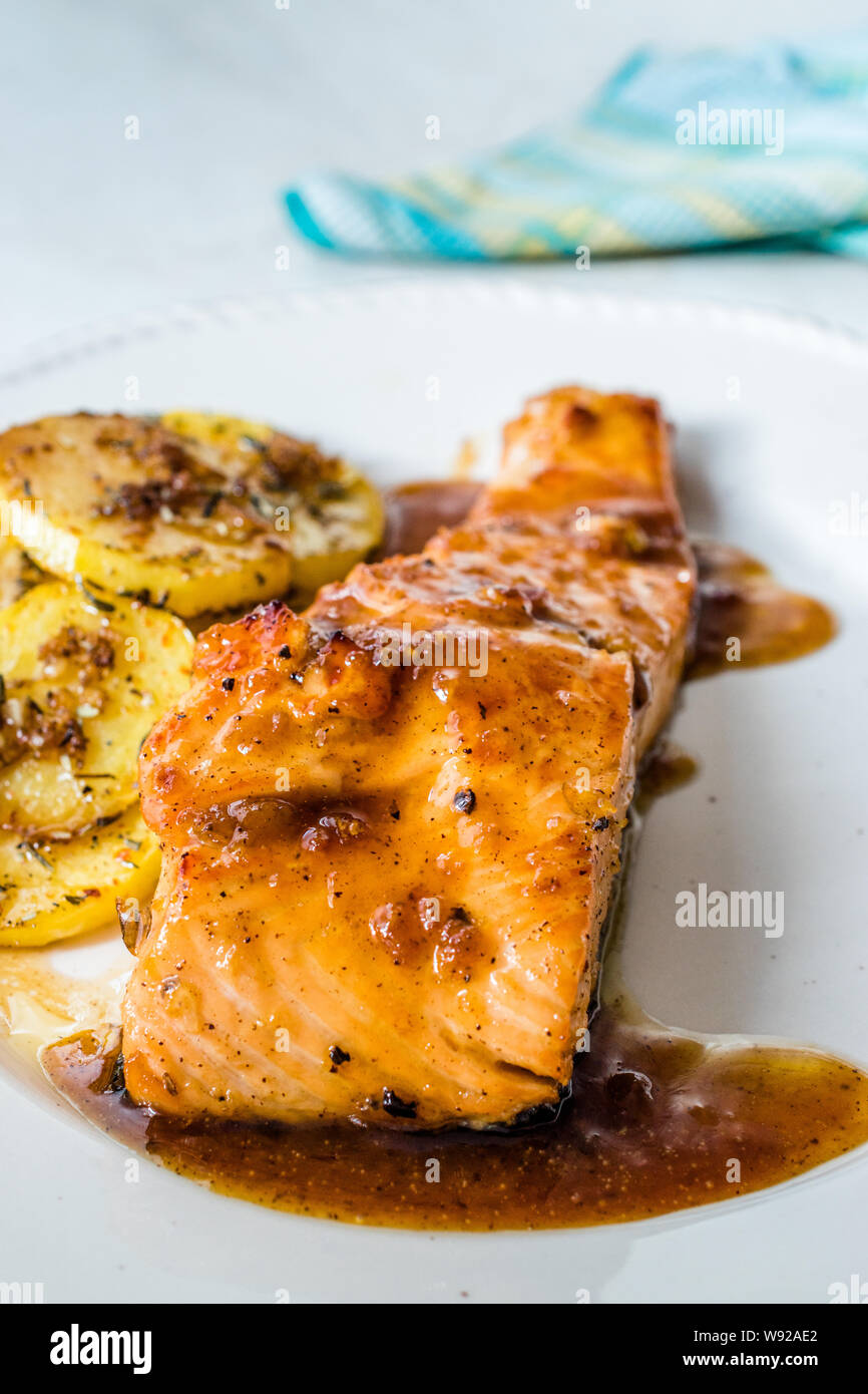 Grilled Salmon with Honey Glaze, Burnt Butter and Baked Potatoes. Ready to Serve Stock Photo Alamy