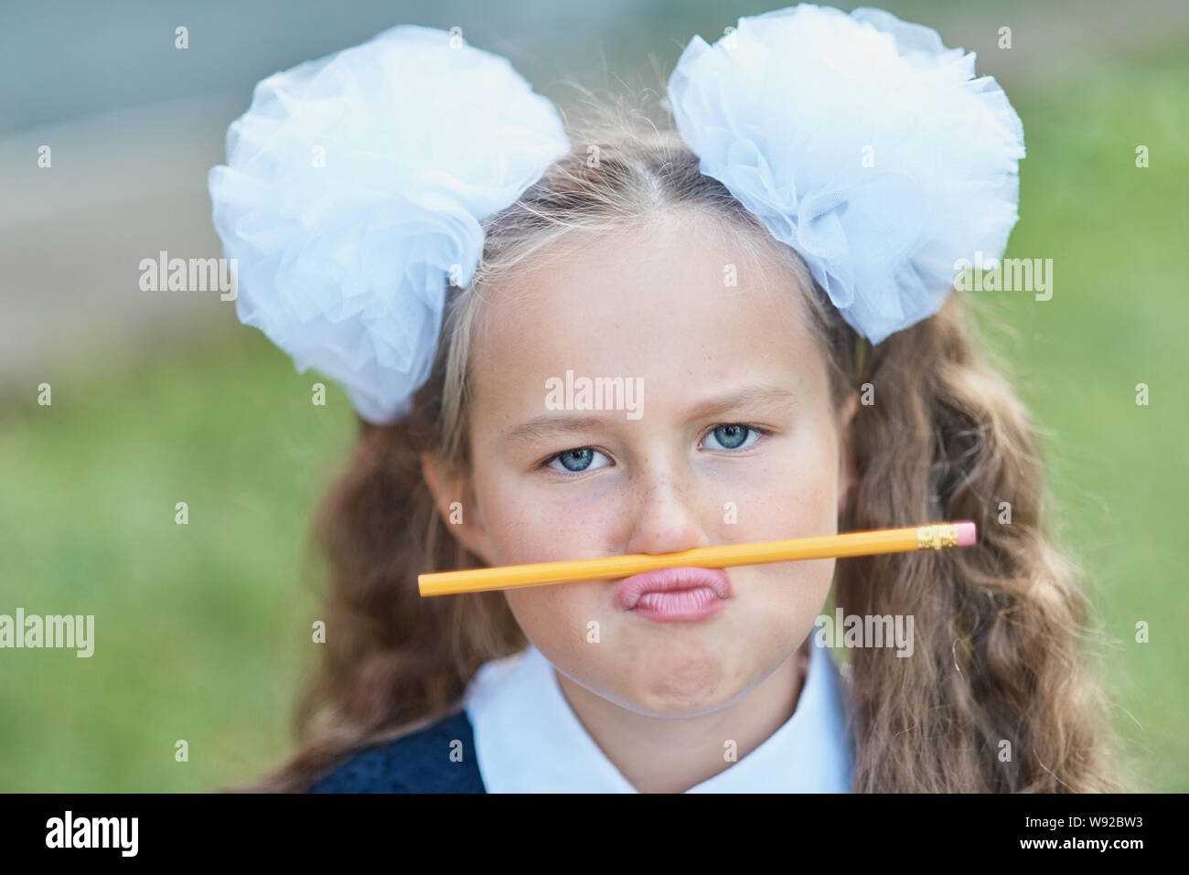 Silly First Grade Funny Portrait of beautiful young first-grader Farewell Bell. day of ...