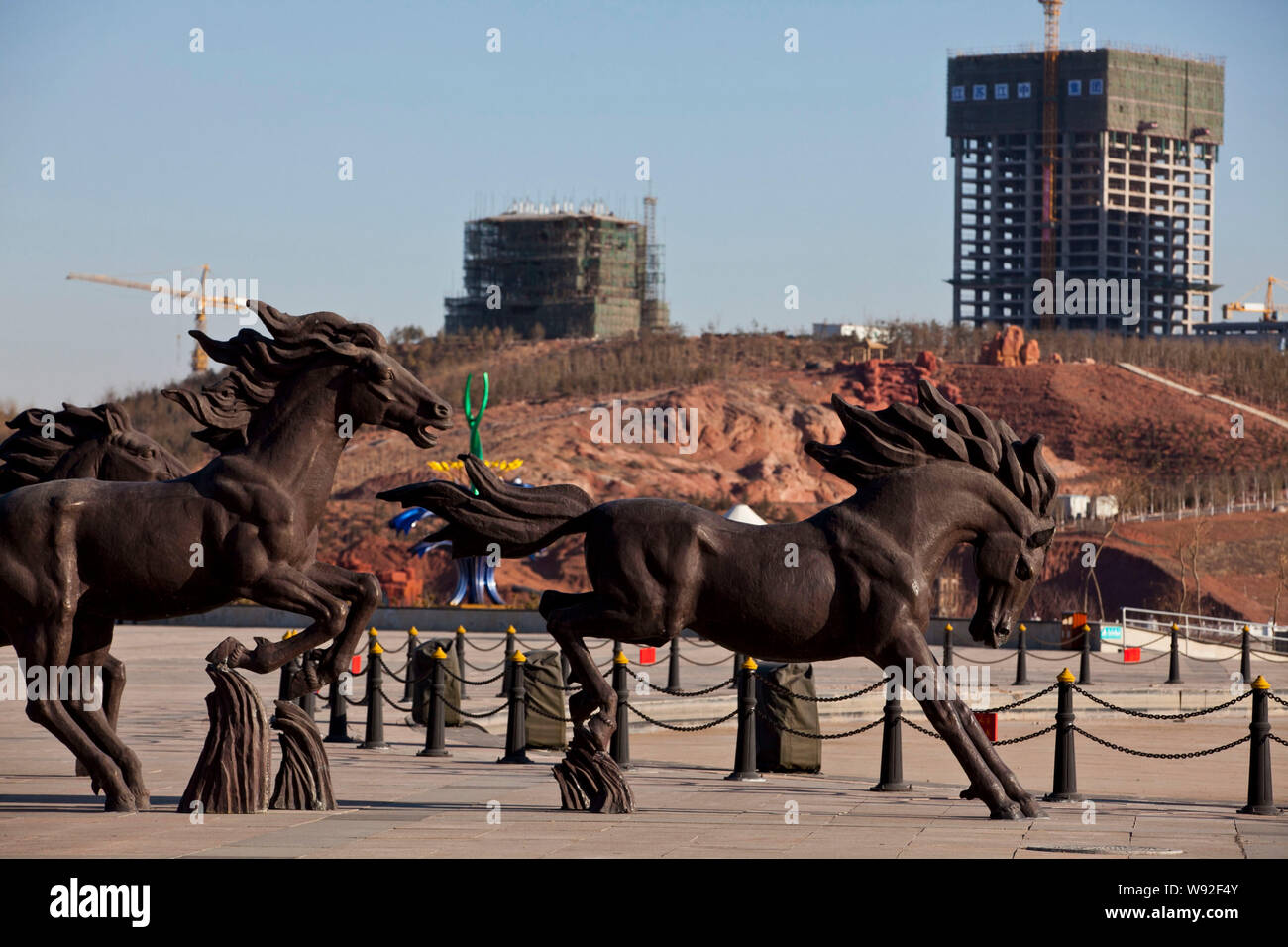 --FILE--Horse sculptures are seen in front of new buildings under ...