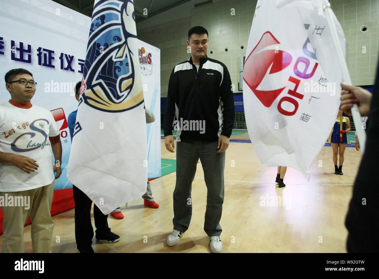 Former NBA basketball player Yao Ming, center, is pictured during a ceremony for Shanghai Sharks, a Chinas basketball club, to prepare for CBA 2013/20 Stock Photo