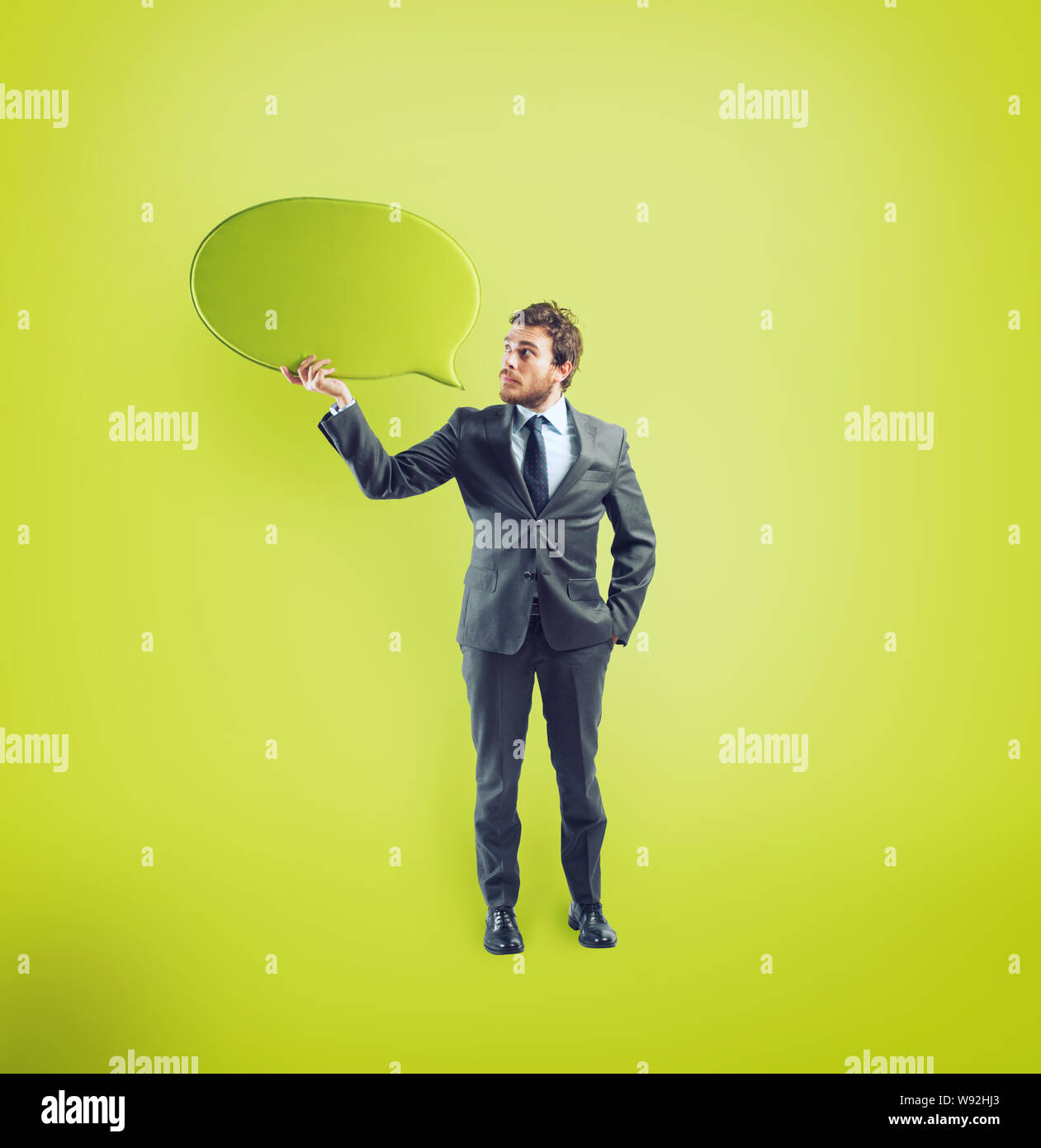 Businessman has something to say in a speech bubble Stock Photo
