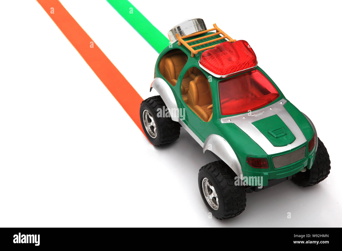 Toy car moving on a tricolored track Stock Photo Alamy