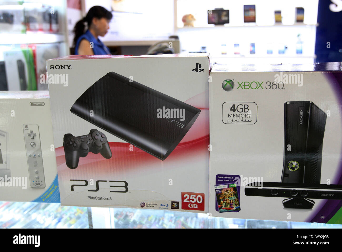 Sony PS3 and Microsoft XBOX 360 game consoles are for sale at a stall in a  digital products mall in Shanghai, China, 10 July 2013. China is expected  Stock Photo - Alamy