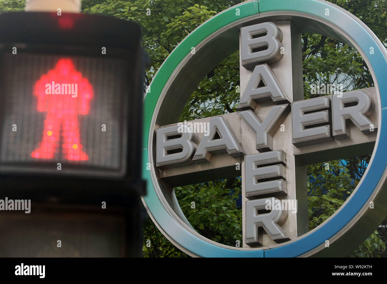 --FILE--A red light is pictured in front of the logo of Bayer in the Lujiazui Financial District in Pudong, Shanghai, China, 21 May 2012.   German pha Stock Photo