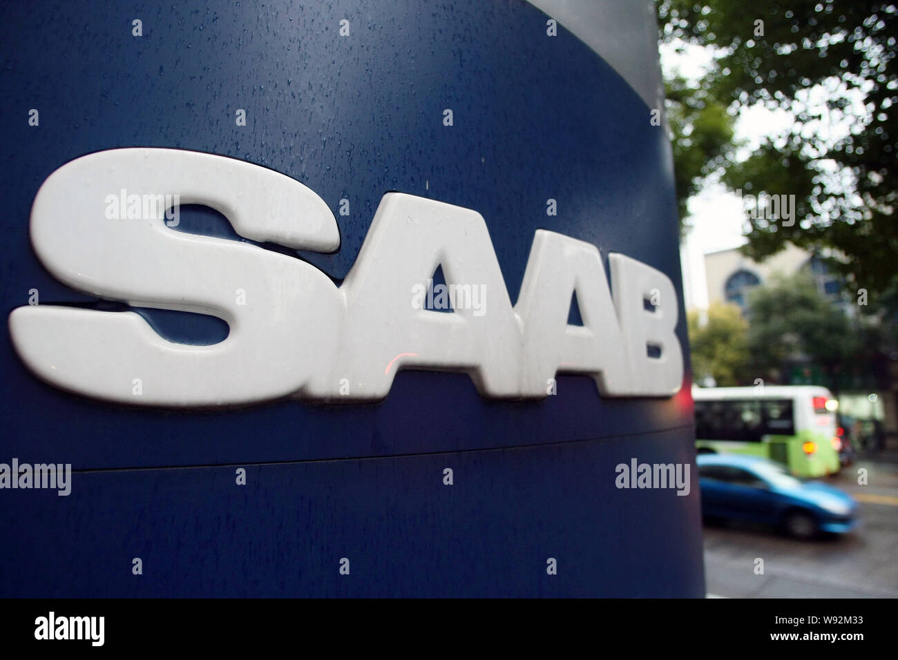 --FILE--Vehicles pass by a Saab dealership in Shanghai, China, 20 December 2011.   SAAB Automobile is raising fresh hopes in its Swedish hometown as t Stock Photo