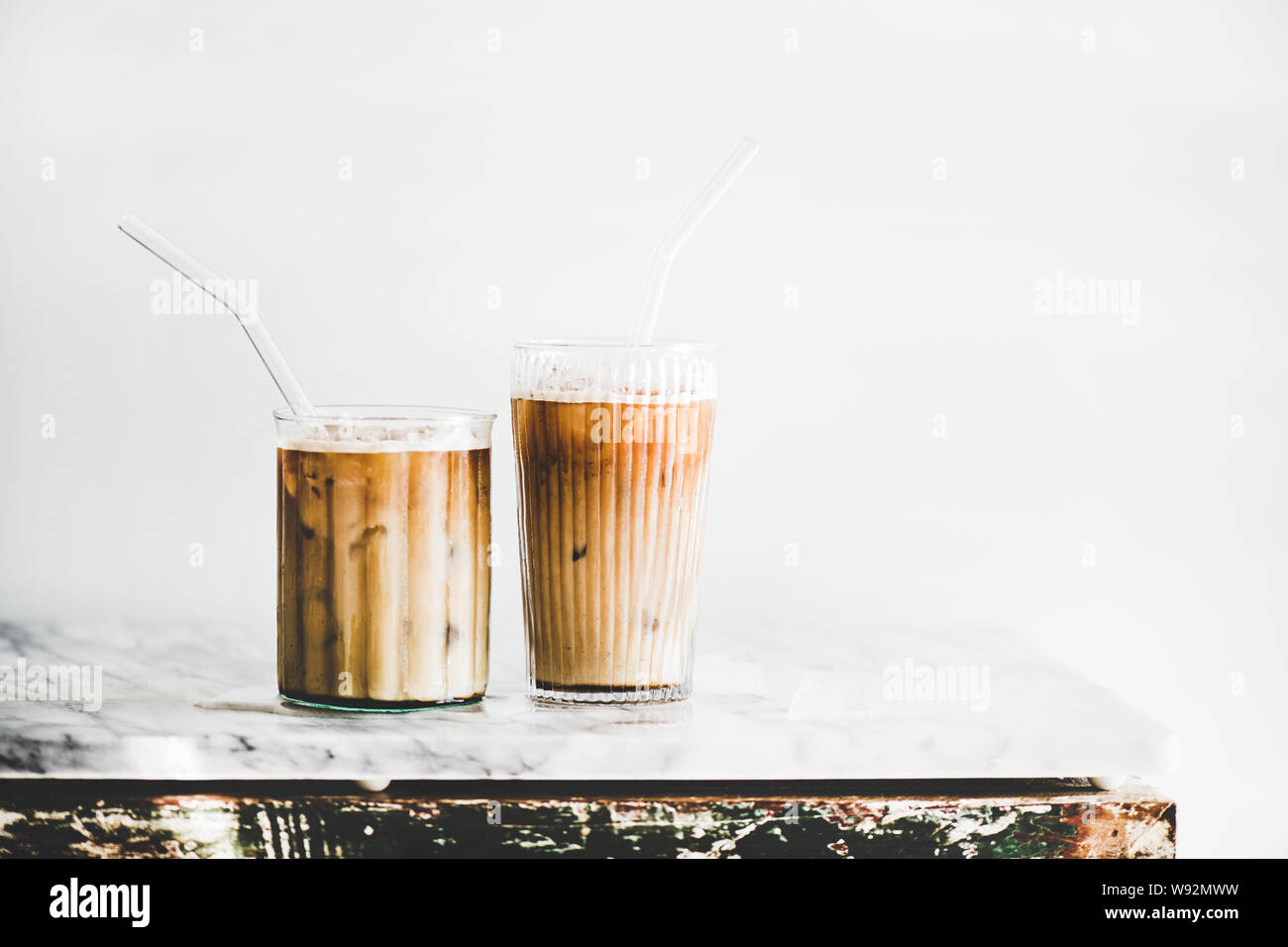 https://c8.alamy.com/comp/W92MWW/iced-latte-coffee-in-glasses-with-straws-whate-wall-background-W92MWW.jpg