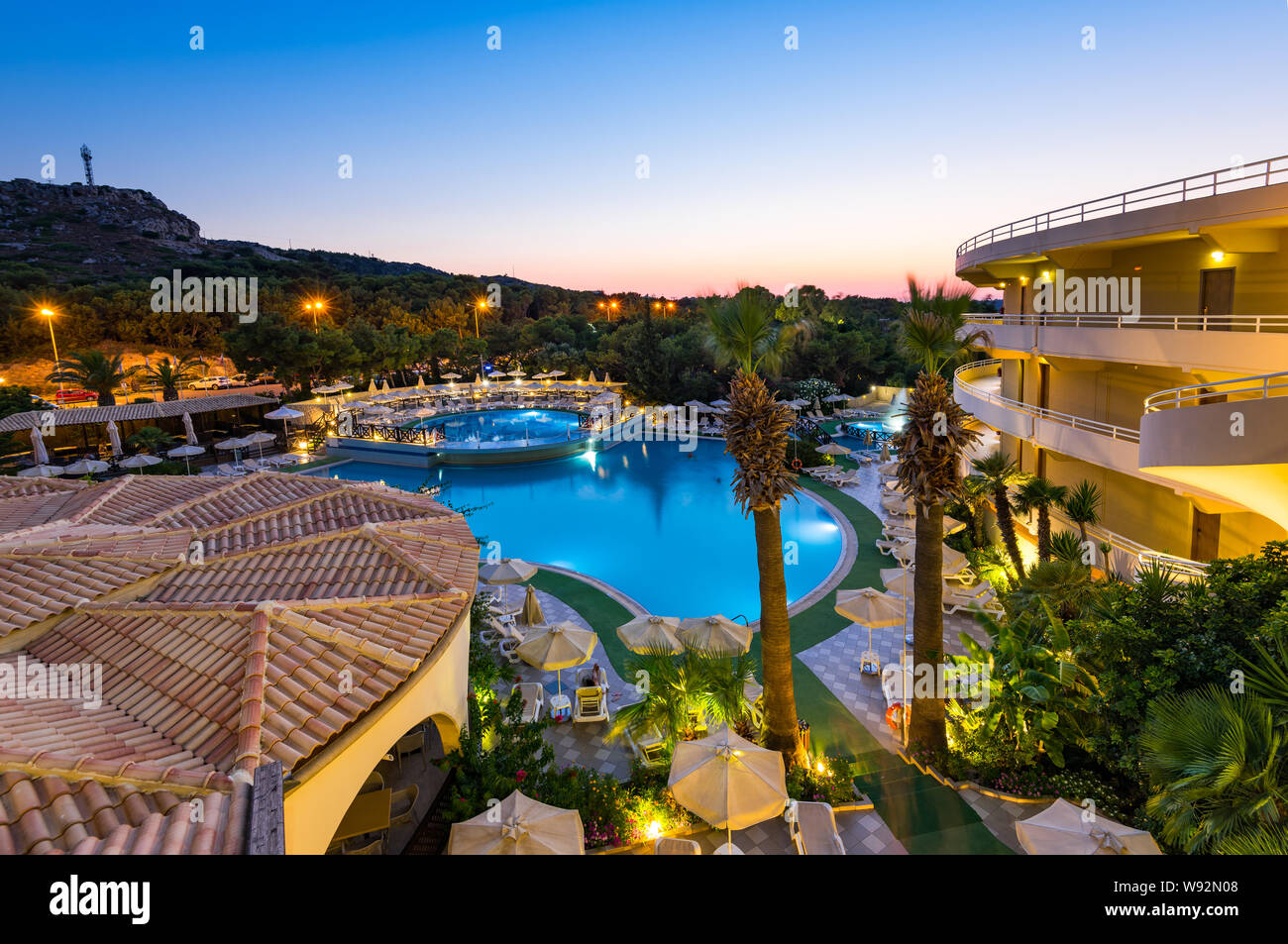 RHODES, GREECE - JULY 24, 2019: Kalithea Mare Palace, Luxury Hotel Resort  with Swimming Poll Illuminated at Sunrise Stock Photo - Alamy