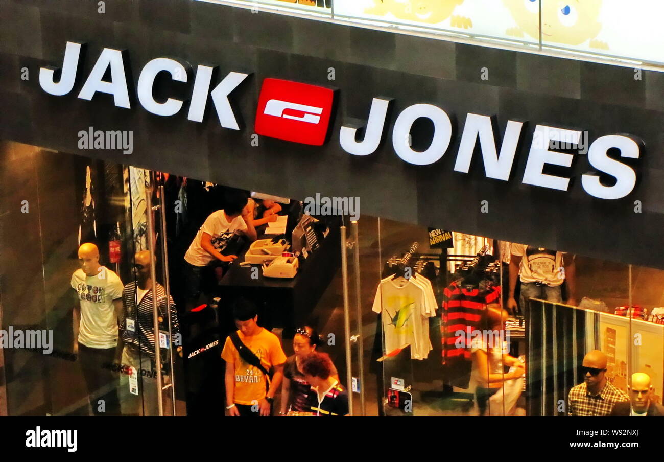 FILE--Customers walk out of a fashion store of Jack & Jones in Shanghai,  China, 27 July 2011. Some batches of clothing from worlds leading fashion  Stock Photo - Alamy