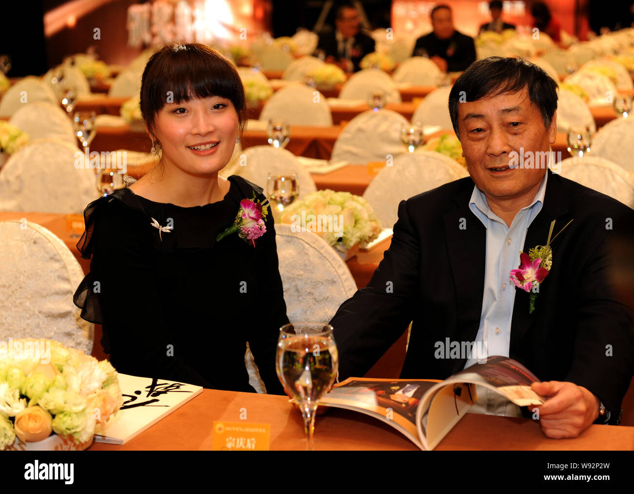 –FILE–Zong Qinghou, right, founder and chairman of Wahaha Group, and