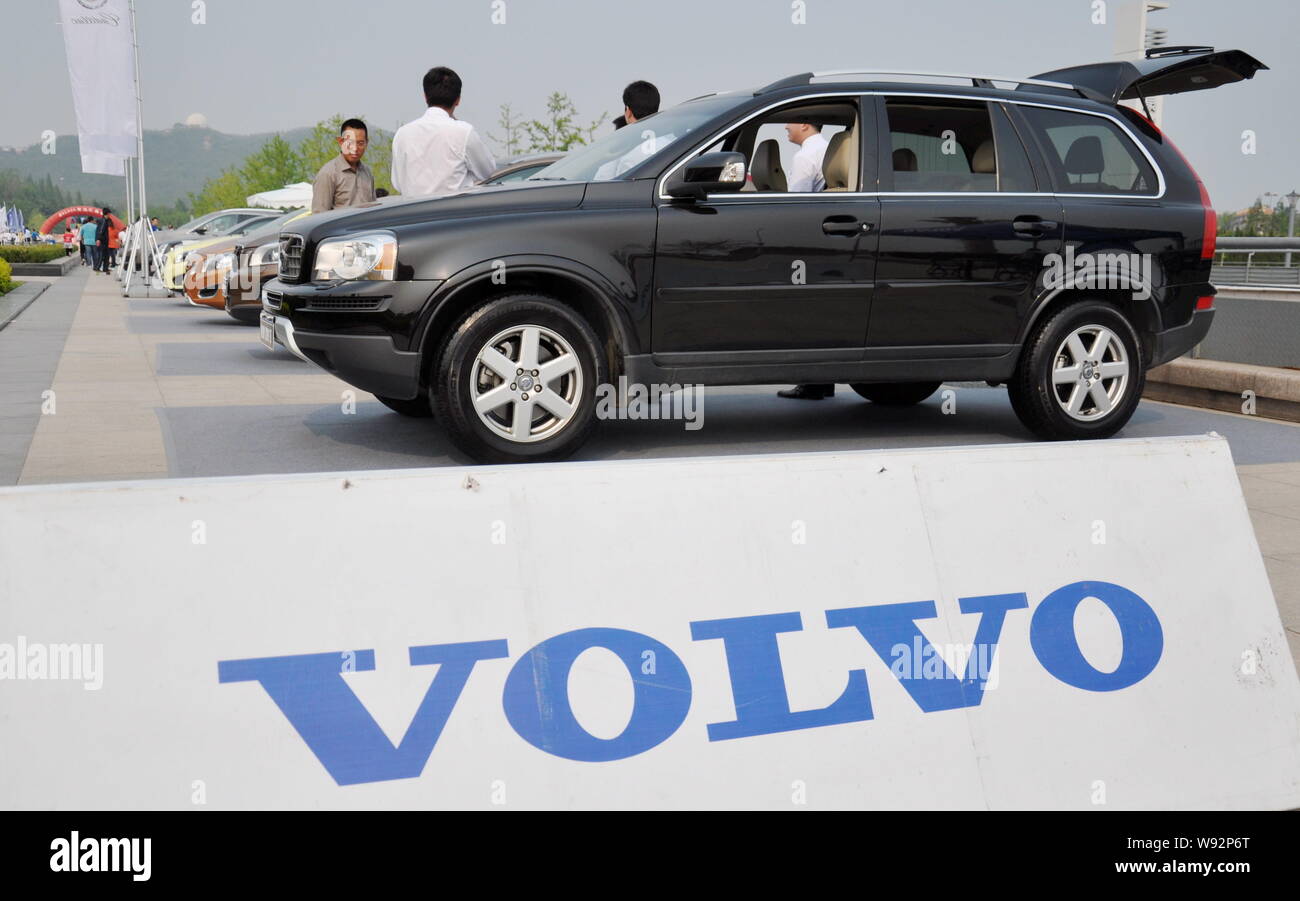 --FILE--People visit the stand of Volvo during an automobile exhibition in Qingdao, east Chinas Shandong province, 5 May 2012.   Conventional wisdom s Stock Photo
