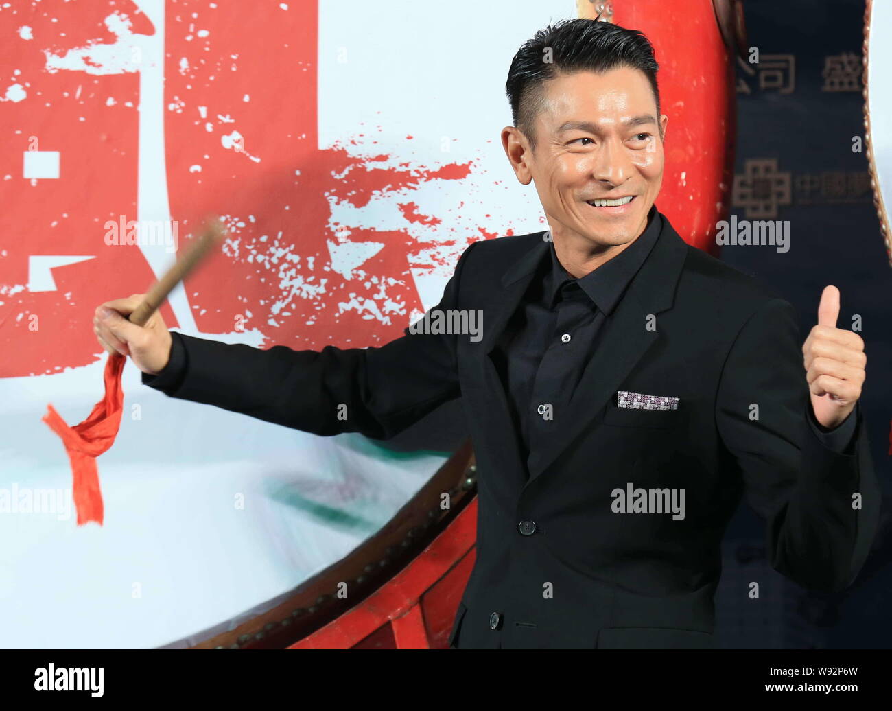 Hong Kong actor Andy Lau poses during a press conference for his new 3D movie, Firestorm, in Beijing, China, 27 October 2013. Stock Photo