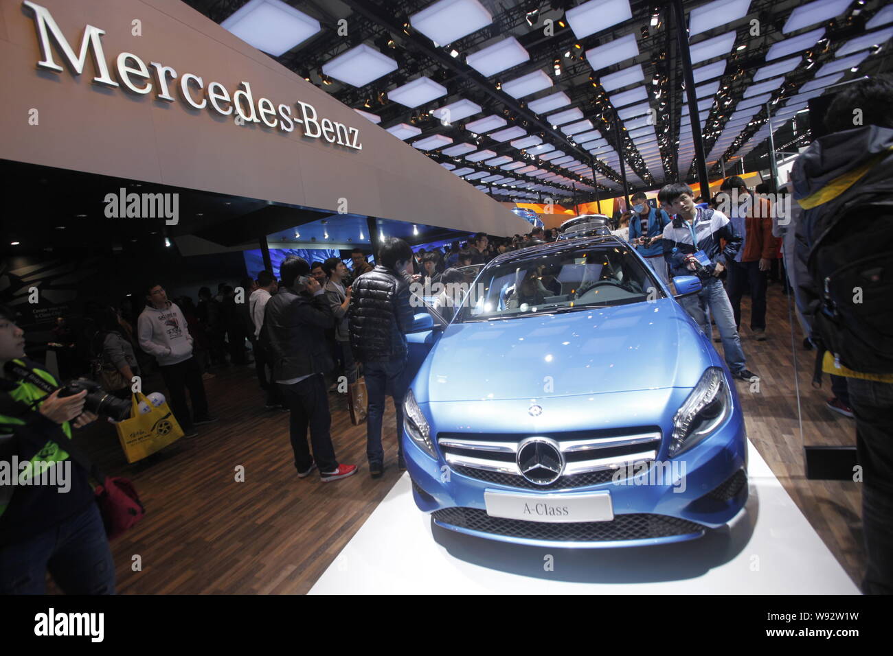 --FILE--Visitors look at a Mercedes-Benz A-Class car during the 15th Shanghai International Automobile Industry Exhibition, known as Auto Shanghai 201 Stock Photo