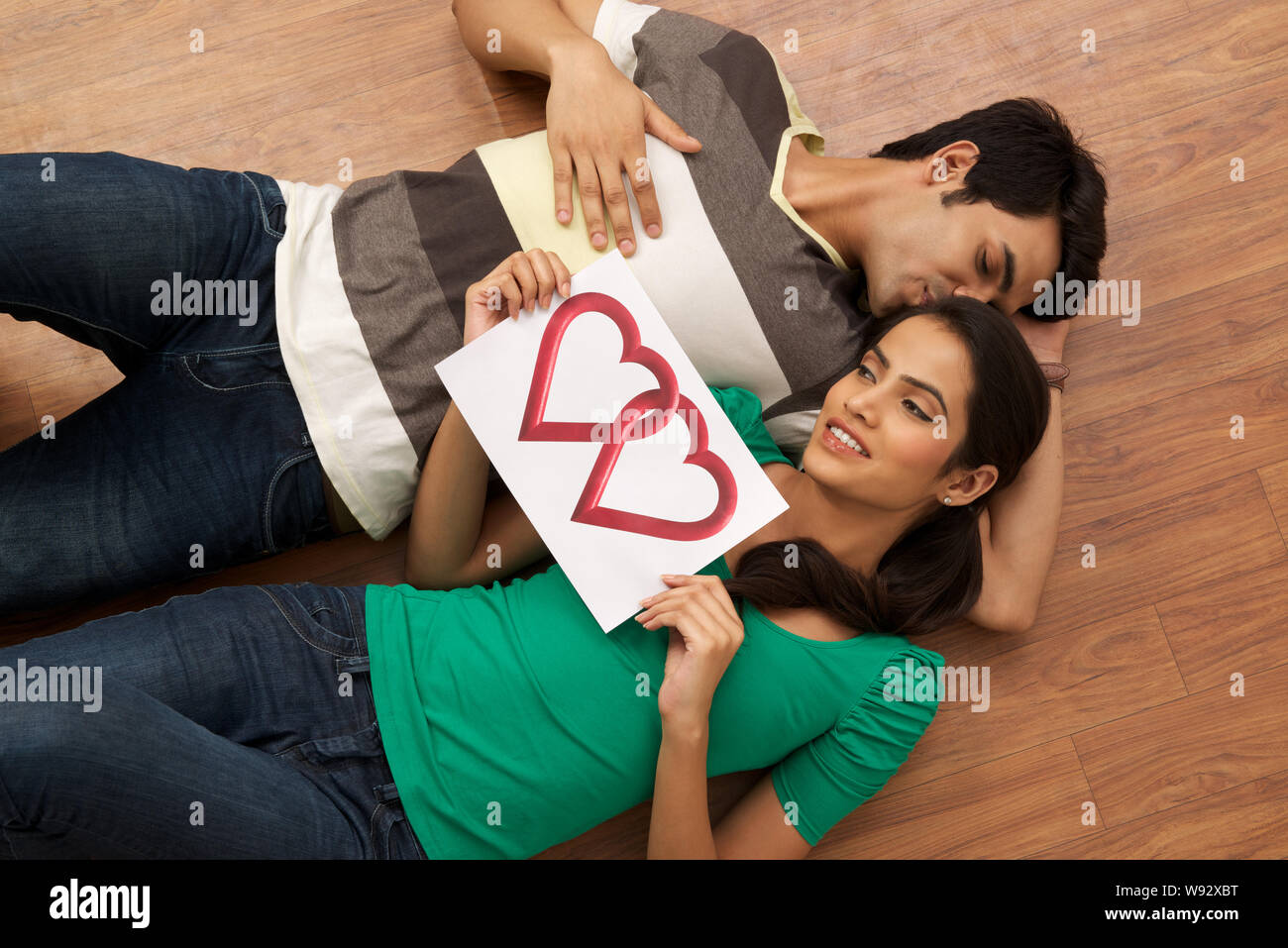 Couple kissing lying down hi-res stock photography and images - Alamy
