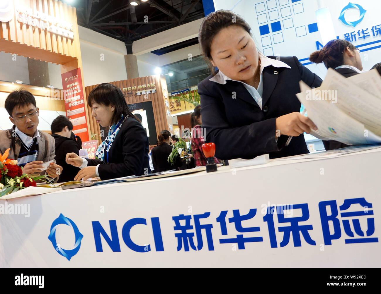 File Chinese Employees Work At The Stand Of Nci New China Life