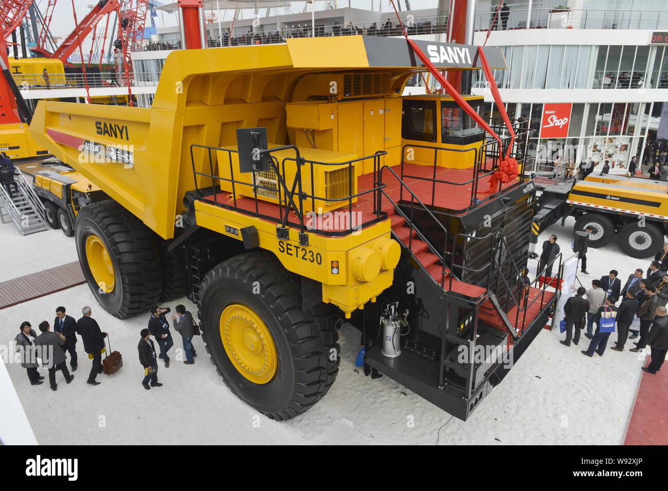 --FILE--Visitors look at a construction machinery of Sany Heavy Industry Co Ltd during the 2012 International Trade Fair for Construction Machinery, B Stock Photo