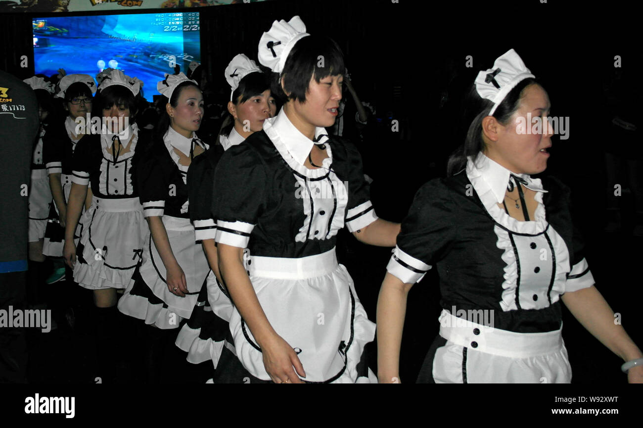 Chinese females dressed up as French maids to attend an attempt of Guinness record-breaking biggest French maid gathering held by 17173 Game in Shangh Stock Photo