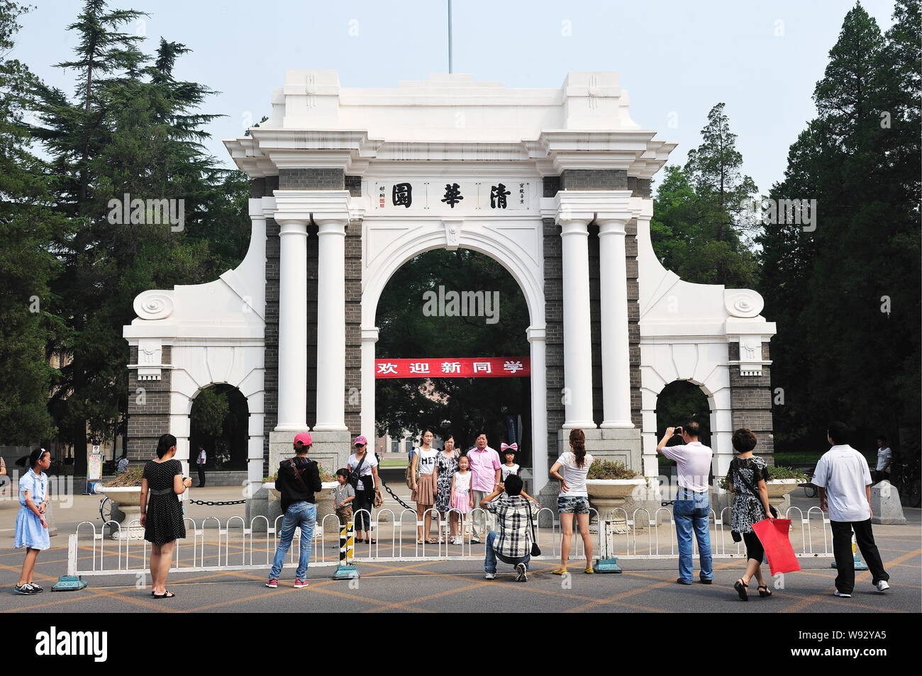 --FILE--People take photos at the symbolic Second Gate of Tsinghua University in Beijing, China, 23 August 2011.   Chinas Tsinghua University, reveale Stock Photo