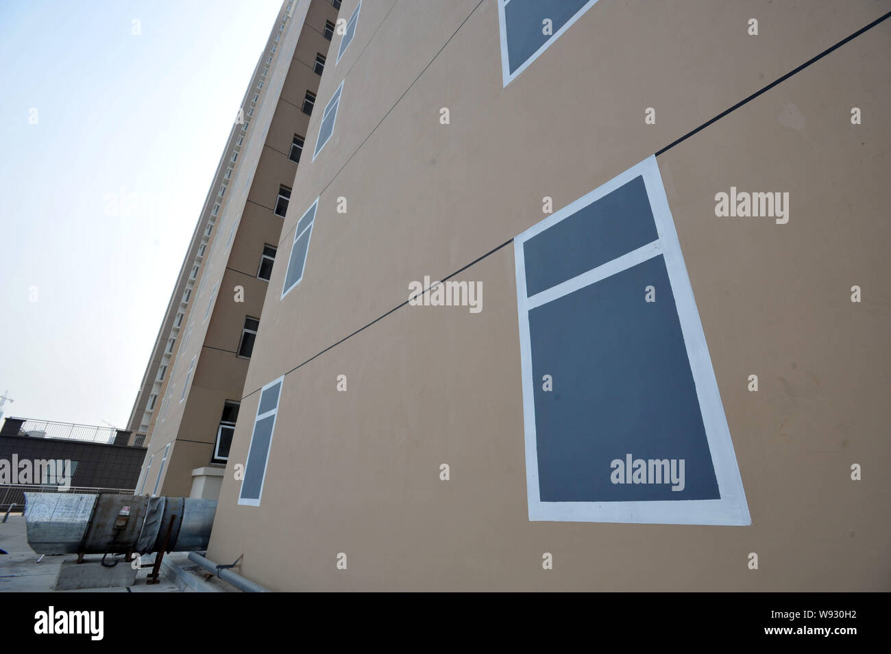 View of windows painted on on a highrise apartment building at a real