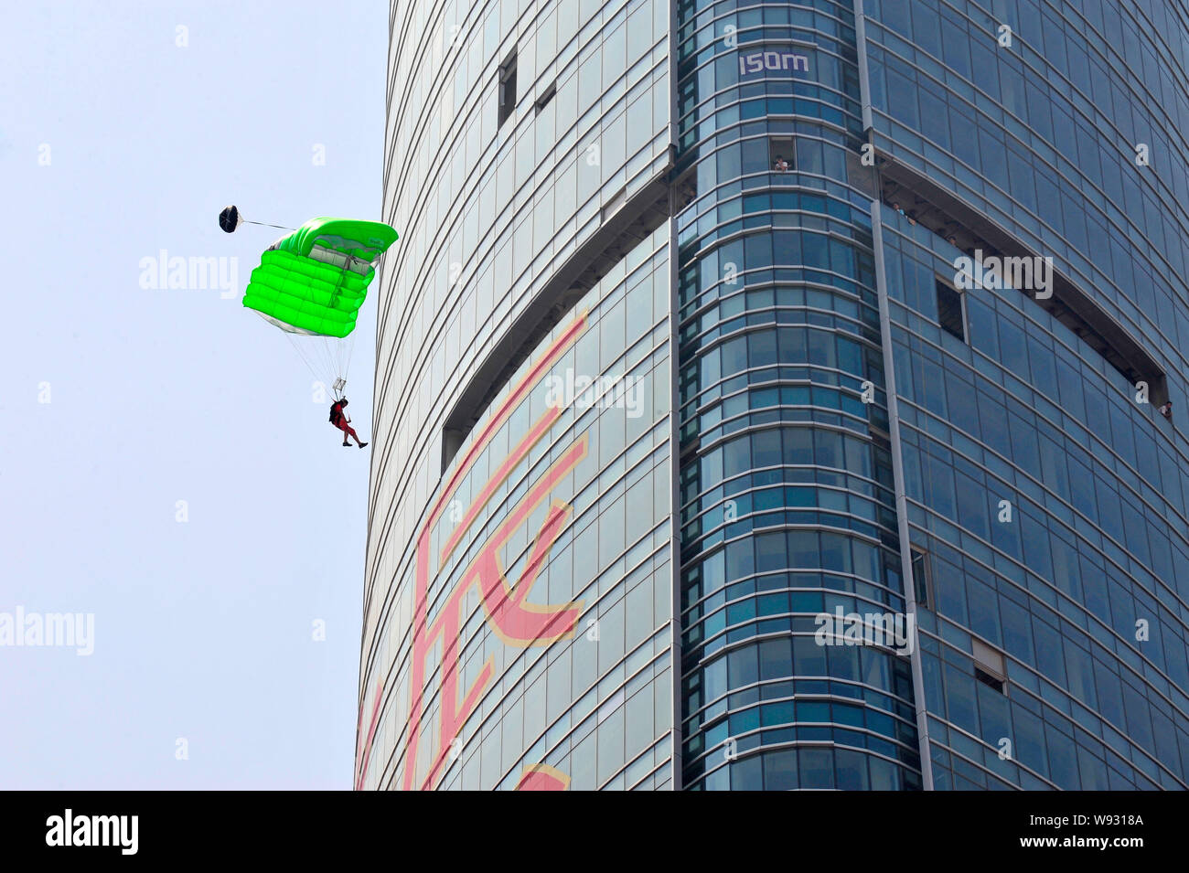 Austrian climber Michael Kemeter parachutes off the 268meterhigh