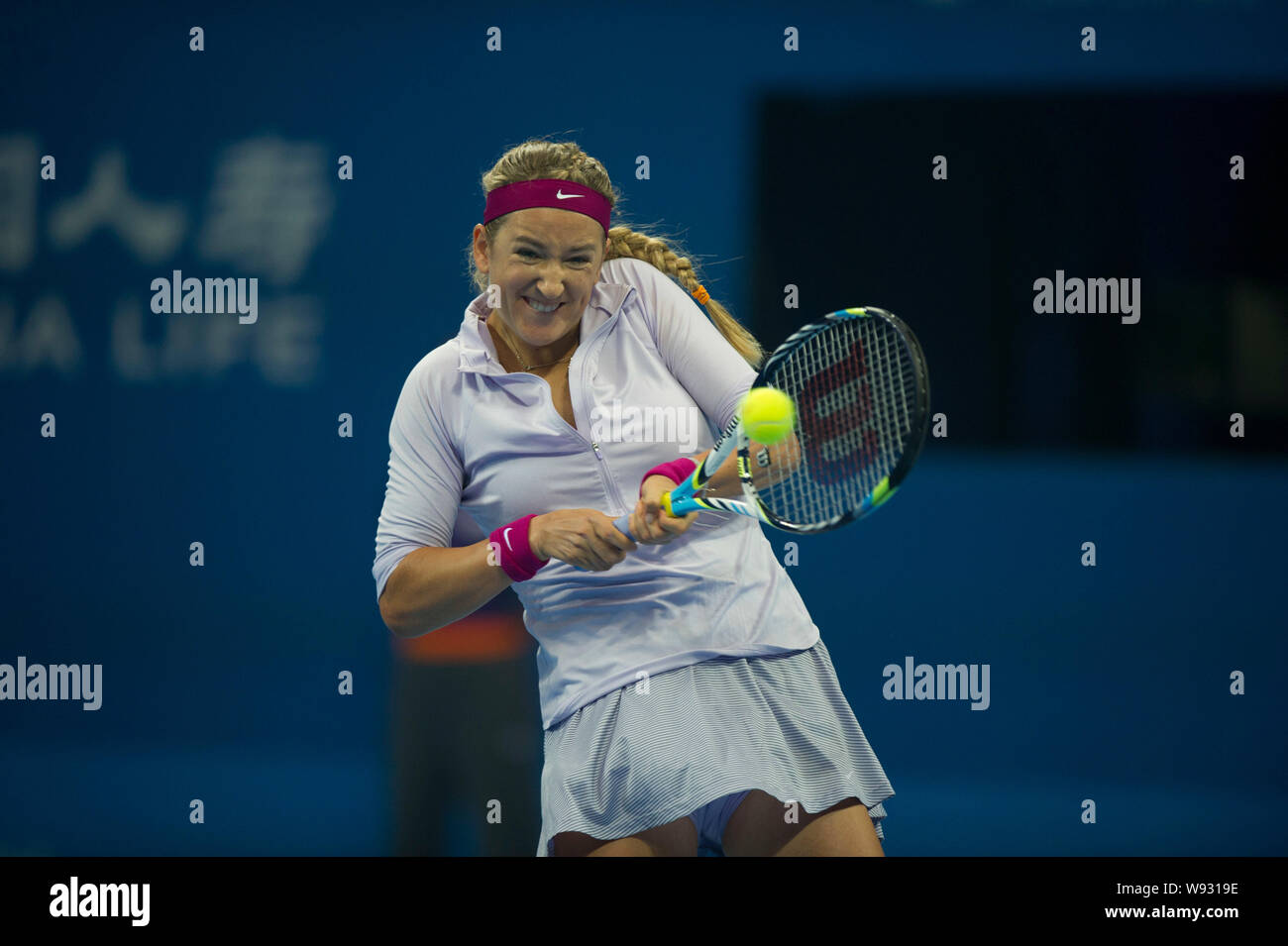 Victoria Azarenka of Belarus returns a shot against Andrea Petkovic of Germany during their first round Womens Singles match of the 2013 China Open te Stock Photo