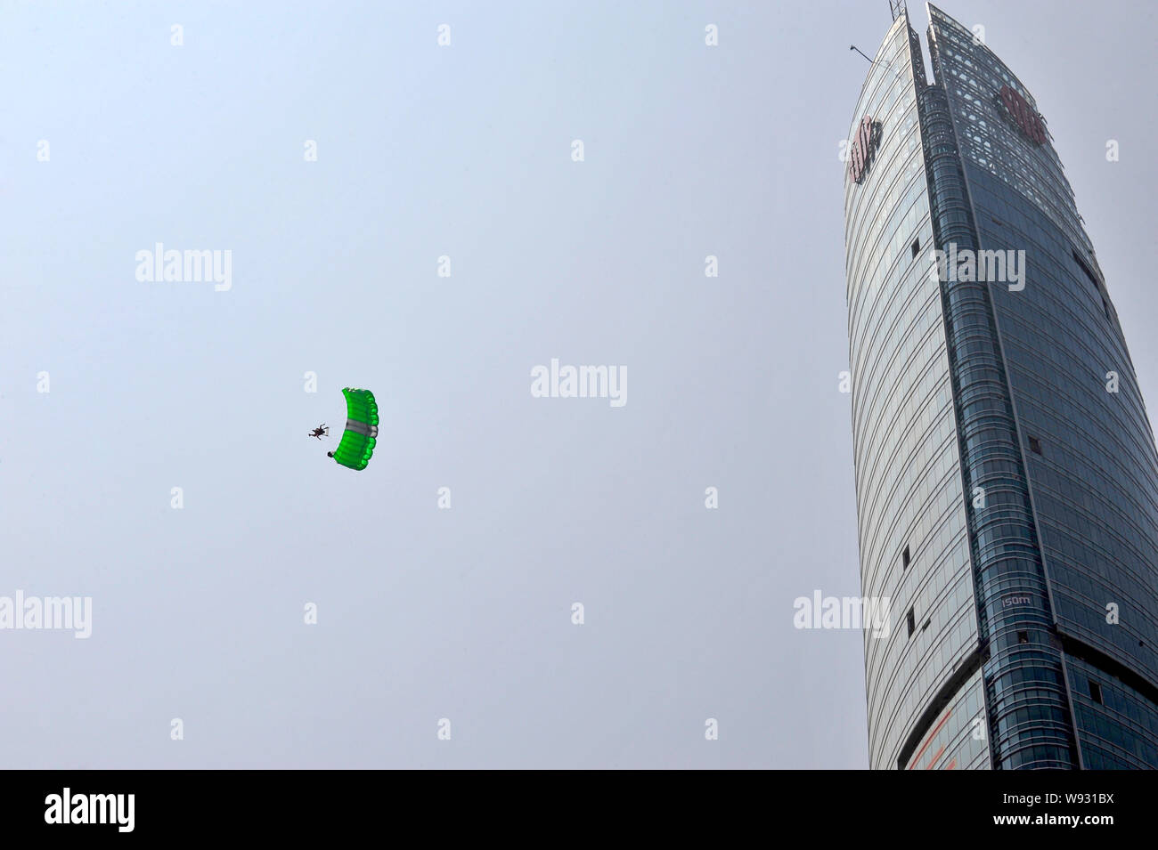 Austrian climber Michael Kemeter parachutes off the 268meterhigh