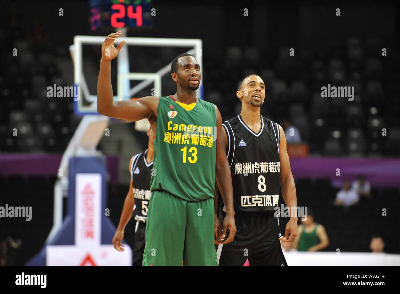 A player of Cameroon National Basketball Team, left, waves after the 2013  Four Nations Mens Basketball Elite Tournament in Shenzhen, southeast Chinas  Stock Photo - Alamy