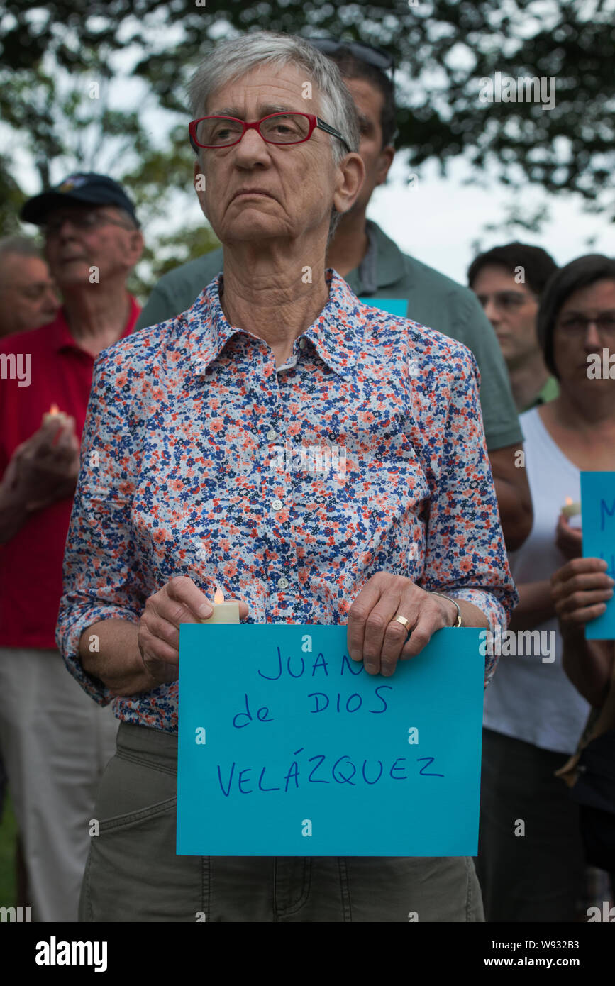 Lexington, MA, USA. 11th Aug, 2019. Enough, Over 100 Lexington residents attended a vigil to end gun violence after U.S. mass gun shootings.  Photo shows attendees holding signs with the name of a victum of the August 3rd, 2019 El Paso, TX, Shooting. Stock Photo