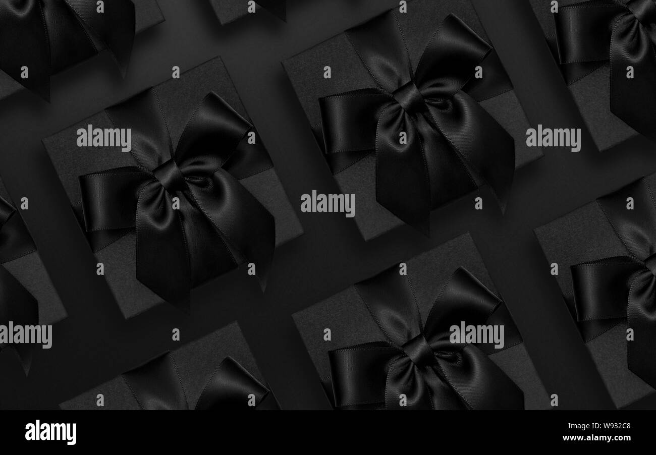 Black gifts on black background, dark gift box flat lay Stock Photo