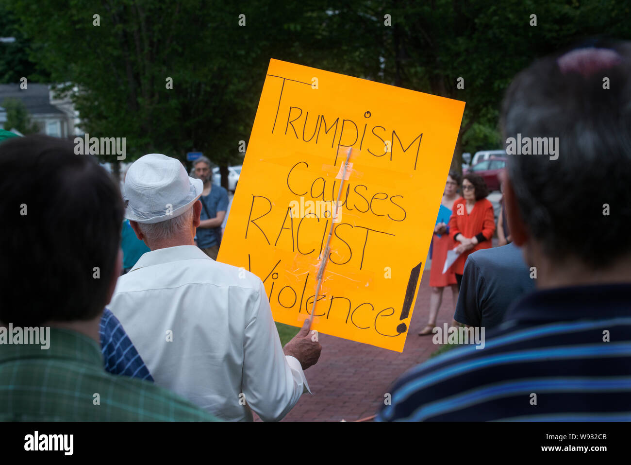 Lexington, MA, USA. 11th Aug, 2019. Enough, Over 100 Lexington residents attended a vigil to end gun violence after U.S. mass gun shootings. Stock Photo