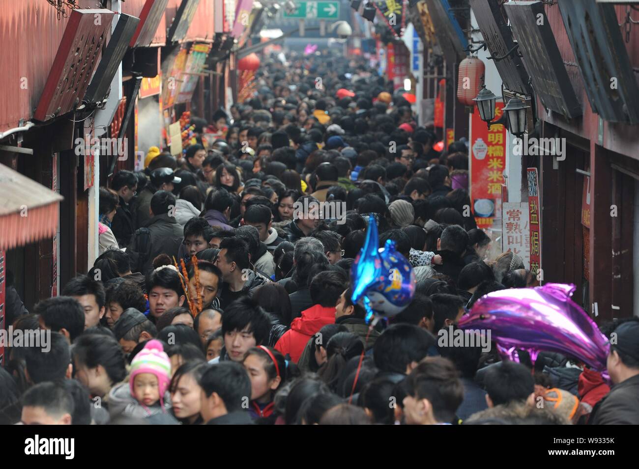 Tourists crowd a street in Qibao Ancient Town during the Spring Festival (or the Chinese New Year) holiday in Shanghai, China, 13 February 2013.   Chi Stock Photo