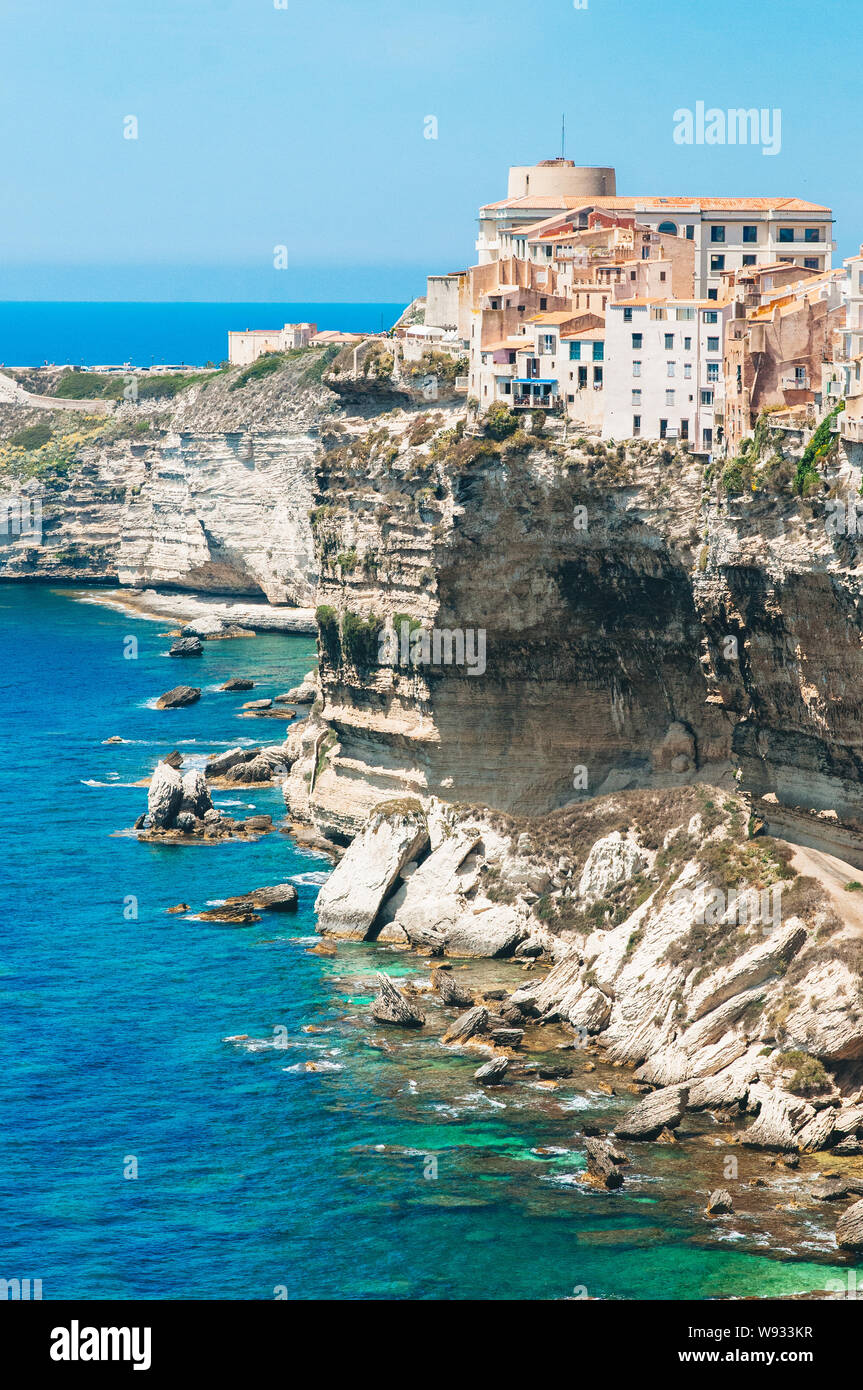 Old houses and city constructed on the edge of high cliffs in Bonifacio, in the mediterranean sea of Corsica Stock Photo