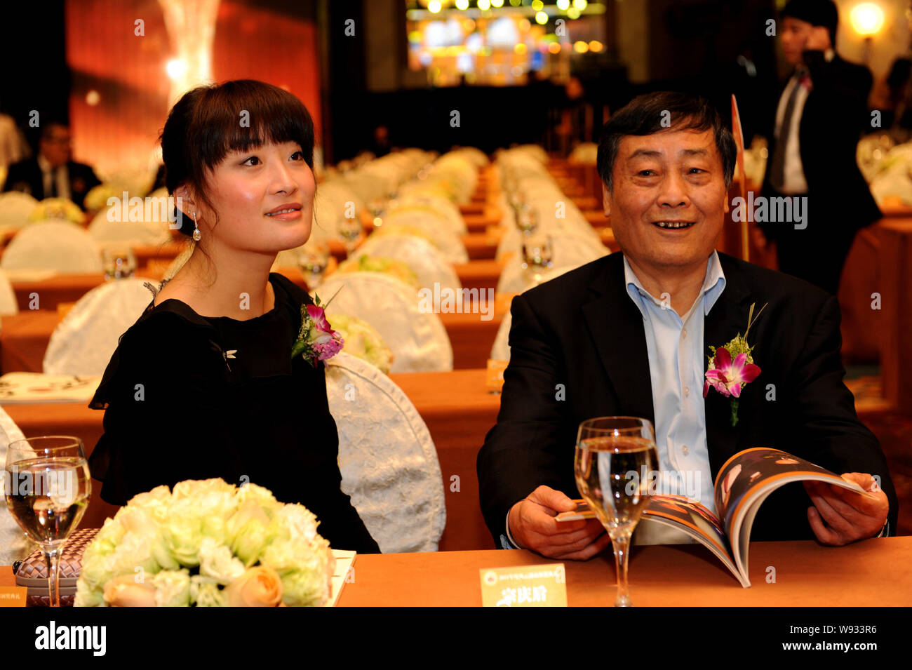 –FILE–Zong Qinghou, right, founder and chairman of Wahaha Group, and
