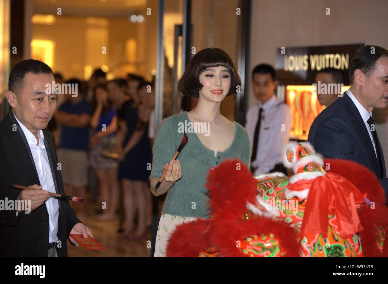 Chinese actor Hu Bing waves as he arrives at the opening ceremony of the  new boutique of Louis Vuitton (LV) at Shin Kong Place in Beijing, China, 26  J Stock Photo - Alamy