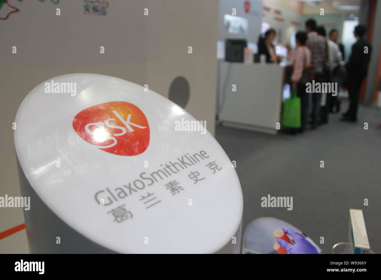 --FILE--People visit the stand of GlaxoSmithKline (GSK) during an exhibition in Shanghai, China, 11 May 2013.   GlaxoSmithKline, the British drug comp Stock Photo