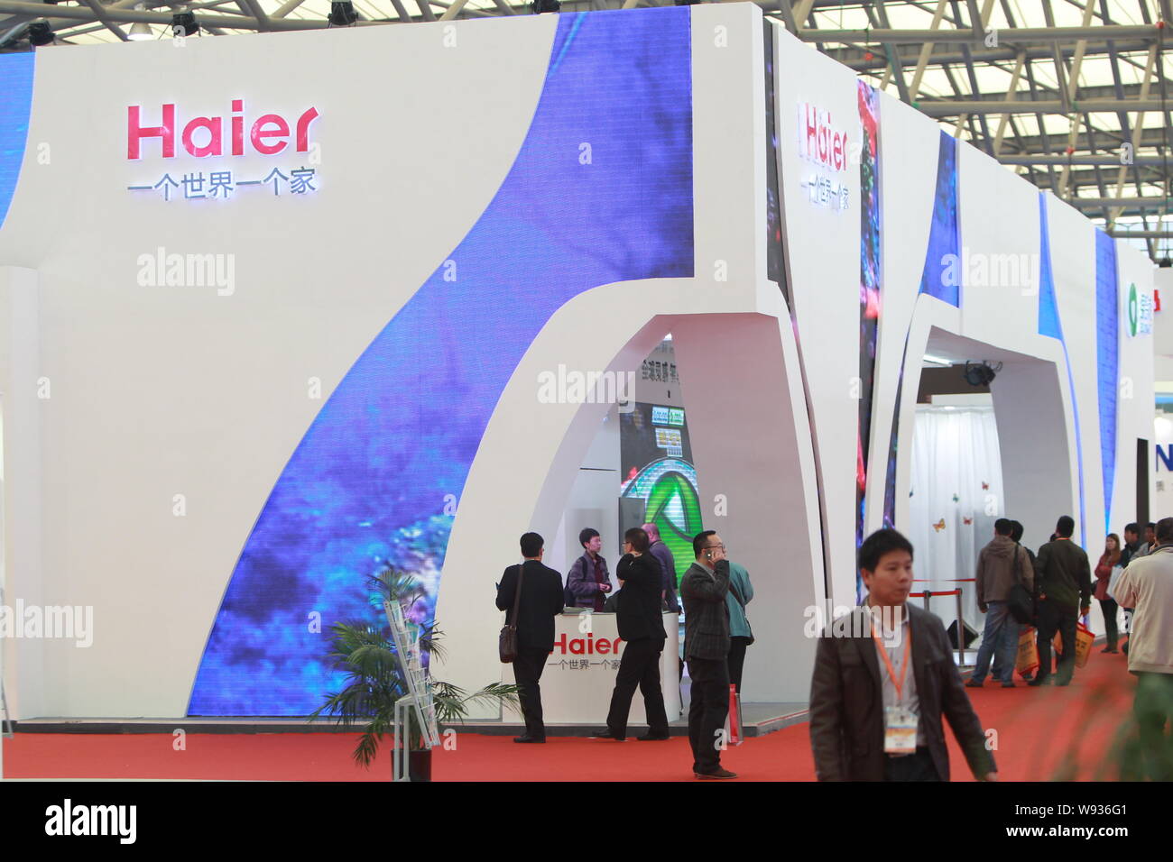 FILE--People visit the stand of Haier during a home appliances 