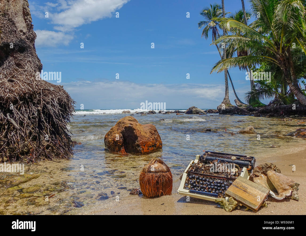 Bastimentos Island, Bocas del Toro, Panama - March 22, 2017: Old typewriter stranded on the shore of a paradisiacal beach Stock Photo