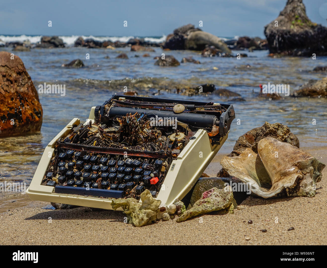 Bastimentos Island, Bocas del Toro, Panama - March 22, 2017: Old typewriter stranded on the shore of a paradisiacal beach Stock Photo
