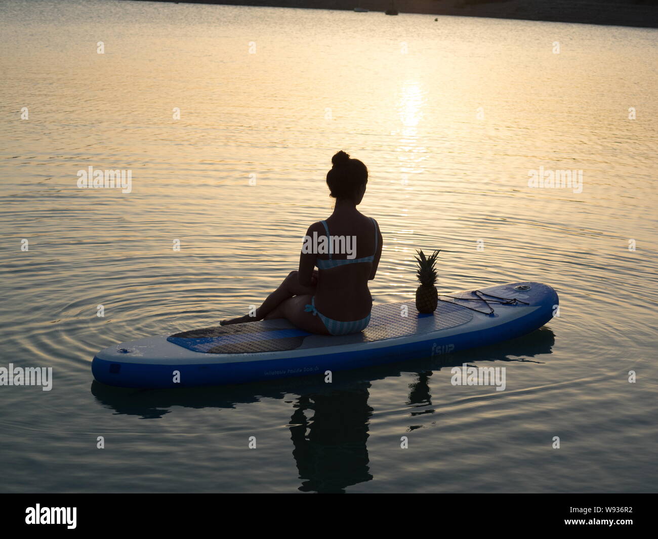 Woman silhouette paddle surf hi-res stock photography and images - Alamy