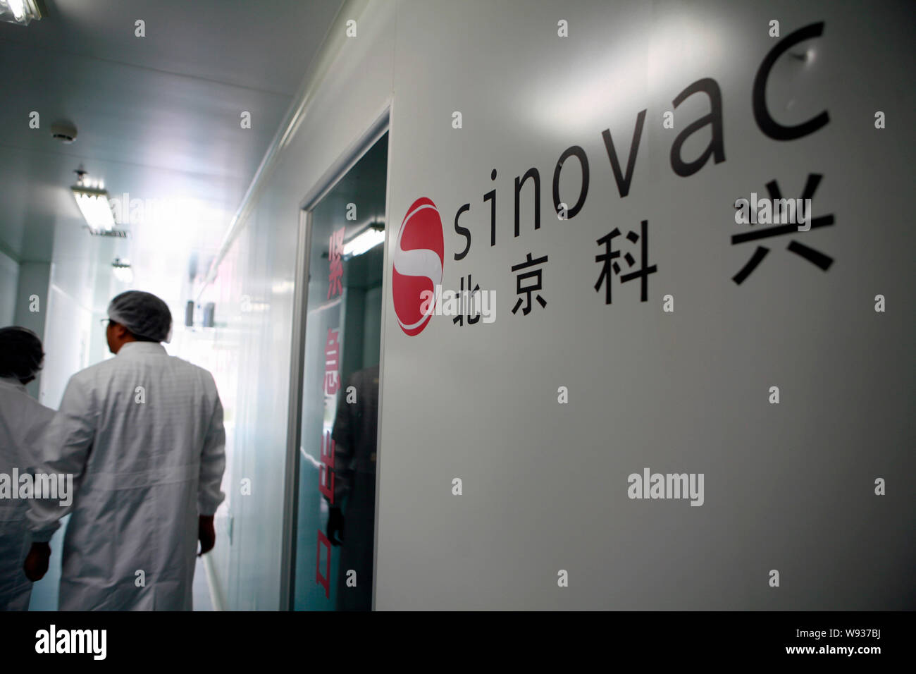 --FILE--Researchers walk past a lab at Sinovac Biotech Co., Ltd. in Beijing, China, 15 September 2009.   China-based Sinovac Biotech Ltd. said a late- Stock Photo