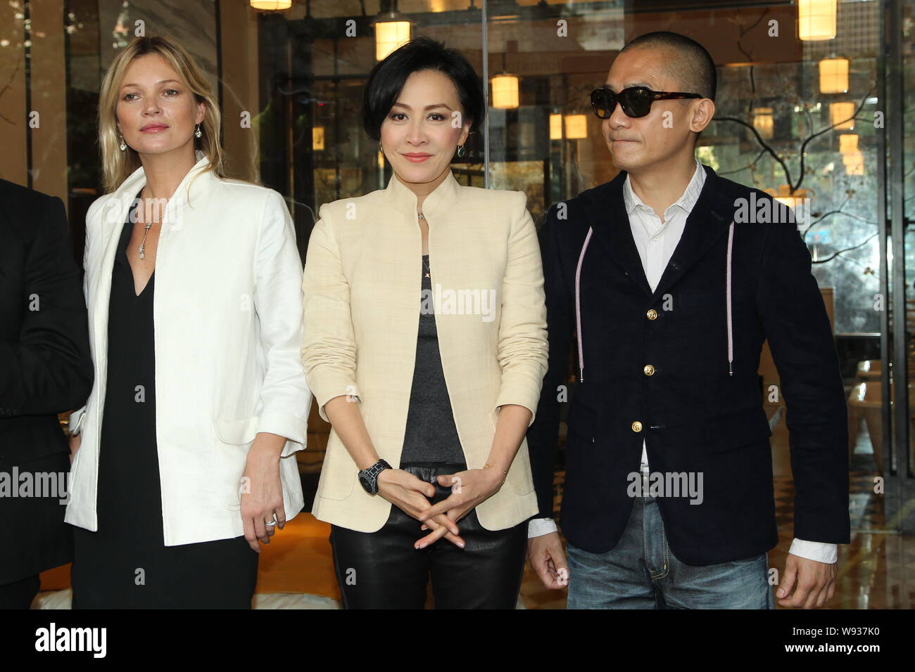 (From left) English supermodel Kate Moss, Hong Kong actress Carina Lau and her actor husband Tony leung chiu wai pose during an opening ceremony for H Stock Photo